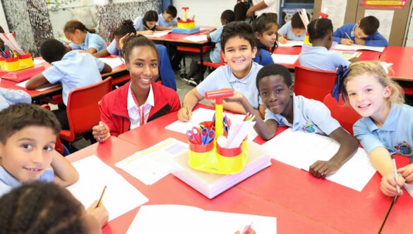 Volunteer mentor working with pupils