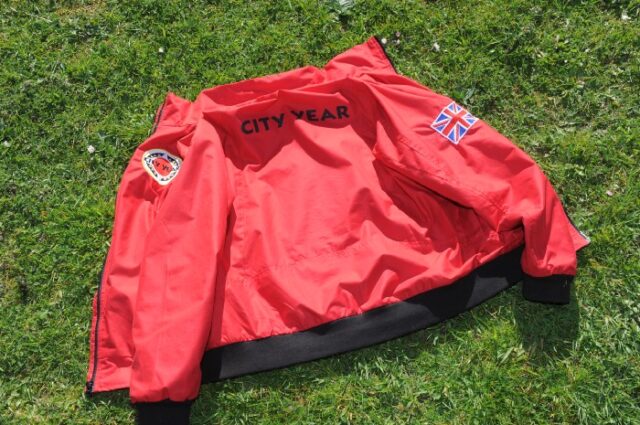 CYUK red jacket on the grass
