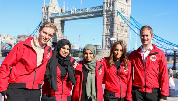 London volunteer mentors in front of Tower Bridge
