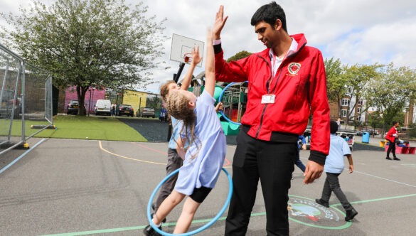 volunteer with pupils on school playground