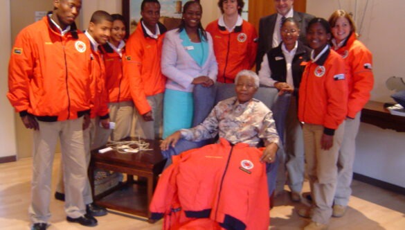 City Year South Africa service leaders standing around Nelson Mandela