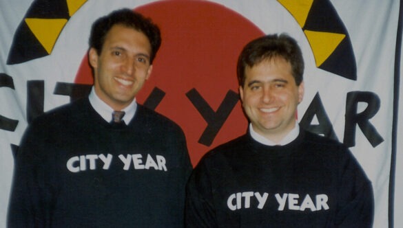 City Year's Co-Founders, Alan Khazei and Michael Brown in black City Year sweatshirts