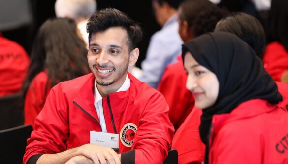 Two volunteer mentors smiling