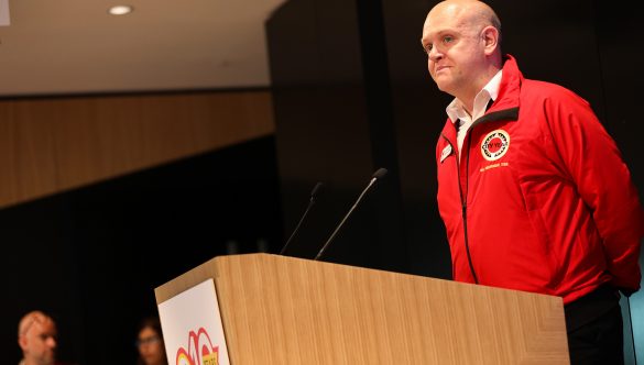 photo of Dean Thomas-Lowde speaking at opening event